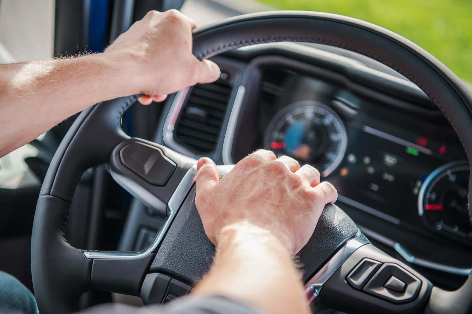 truck-driver-gripping-steering-wheel-while-navigat-2025-03-16-20-03-42-utc-1.jpg